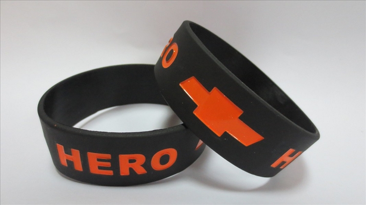 Stack of custom silicone wristbands in assorted colors